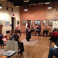 Photo from Eau Claire Artist's Drawing Night event with a model dressed as a pirate